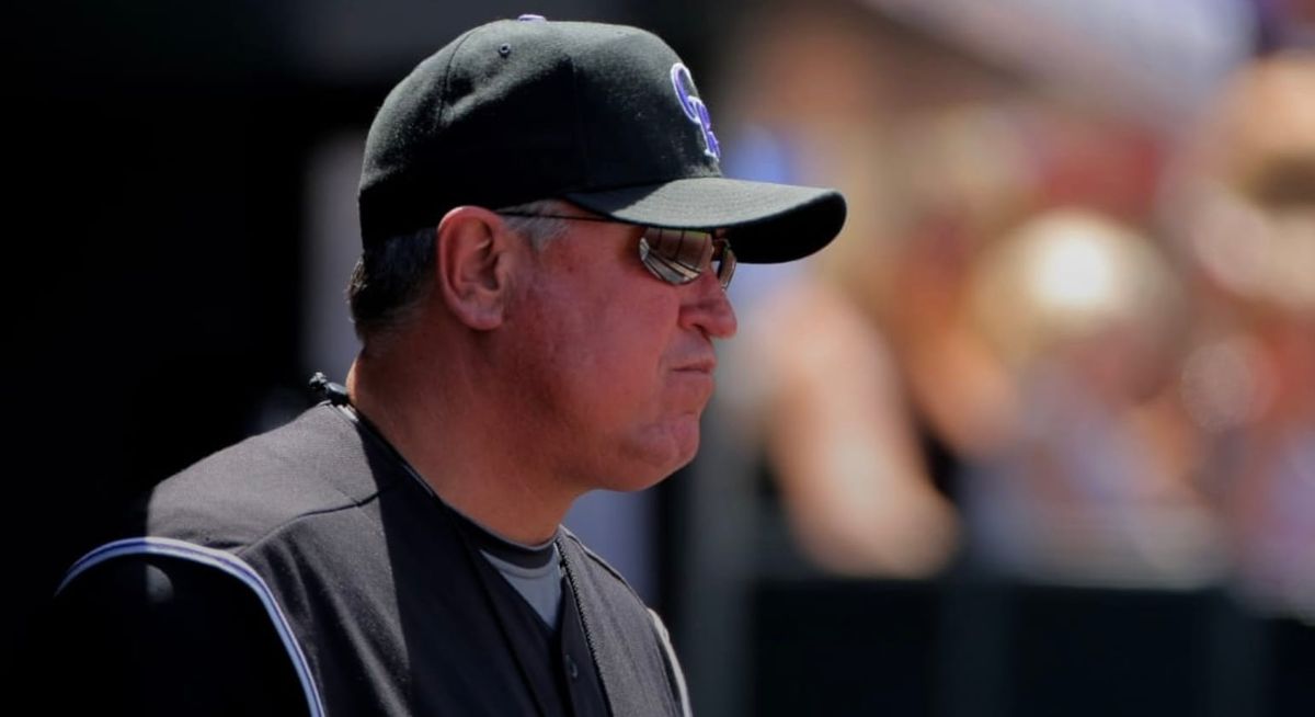 A photo of a younger Clint Hurdle wearing a black vest and Rockies cap.