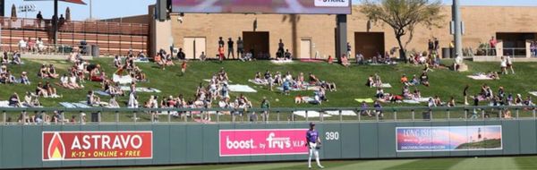 A Rockies outfielder stands in left field.