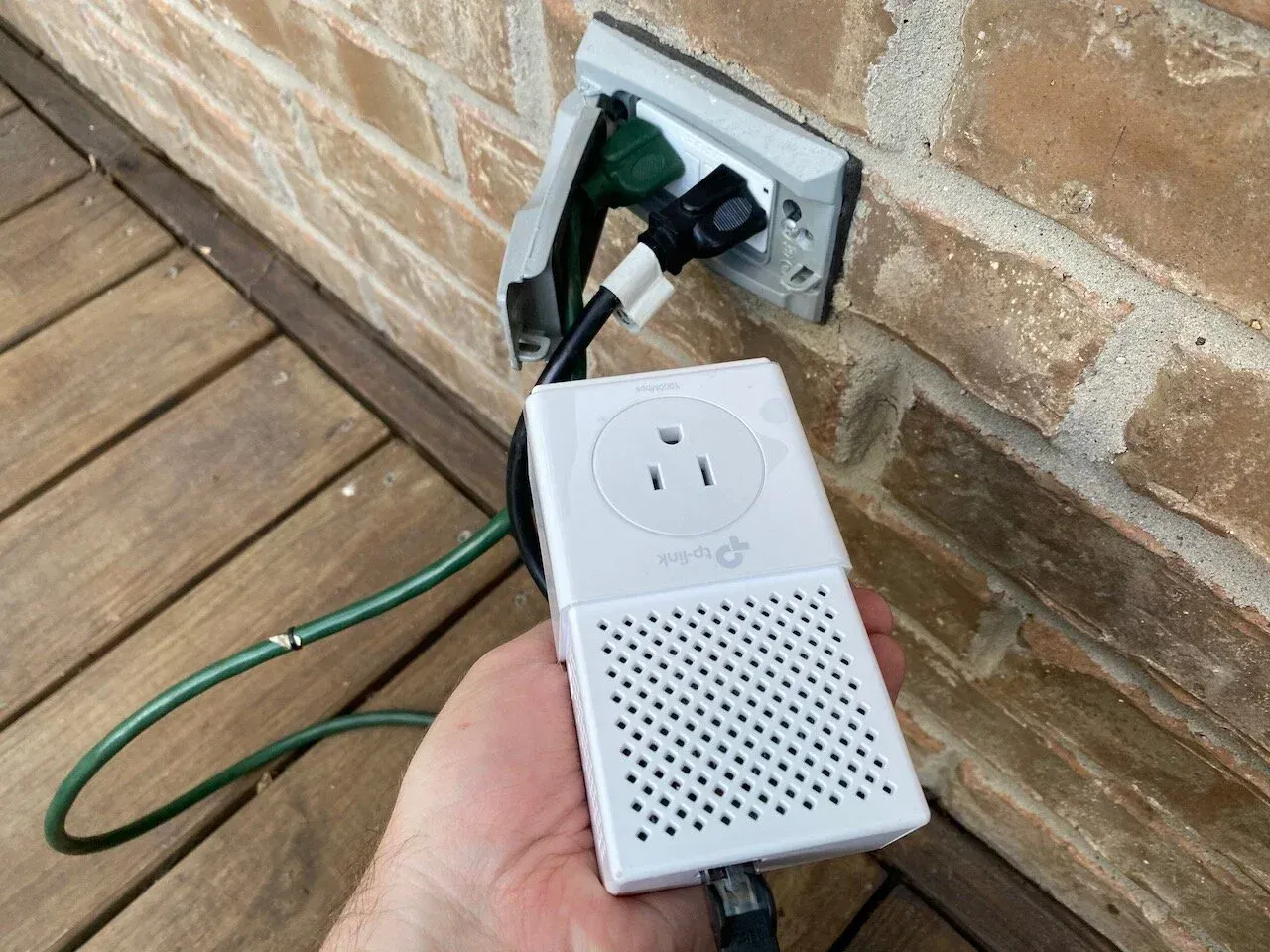  My outdoor outlet with ethernet signal going through the AC outlet into the Powerline device. Ethernet then comes out of that device and goes into my Raspberry Pi. You don’t even use up the outlet, as the Powerline unit has an empty one ready to plug something else into it. 