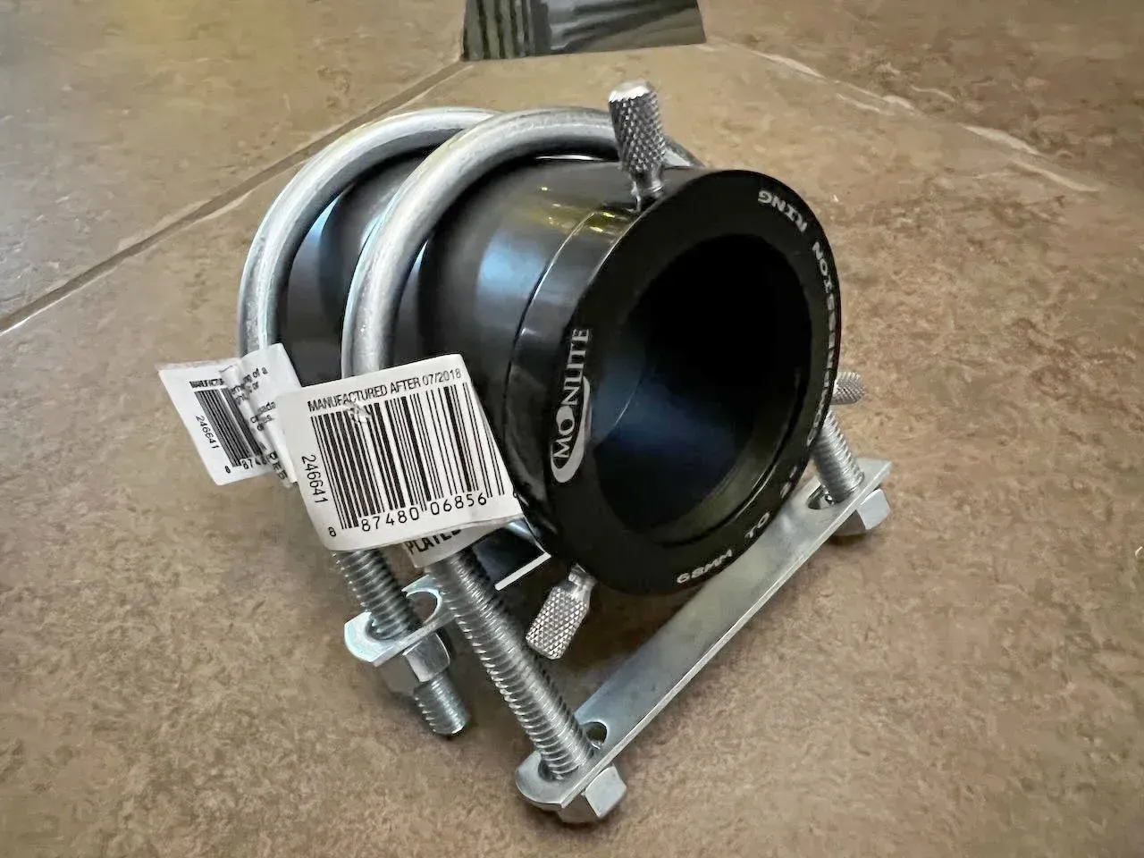  As an alternative to the bearing I used, you can purchase some “2-3 in. U-Bolts” to fit a 2” compression ring with some spacers attached. You need enough spacers attached to extend the barrel so that it can be bolted down to your wood shelf. 