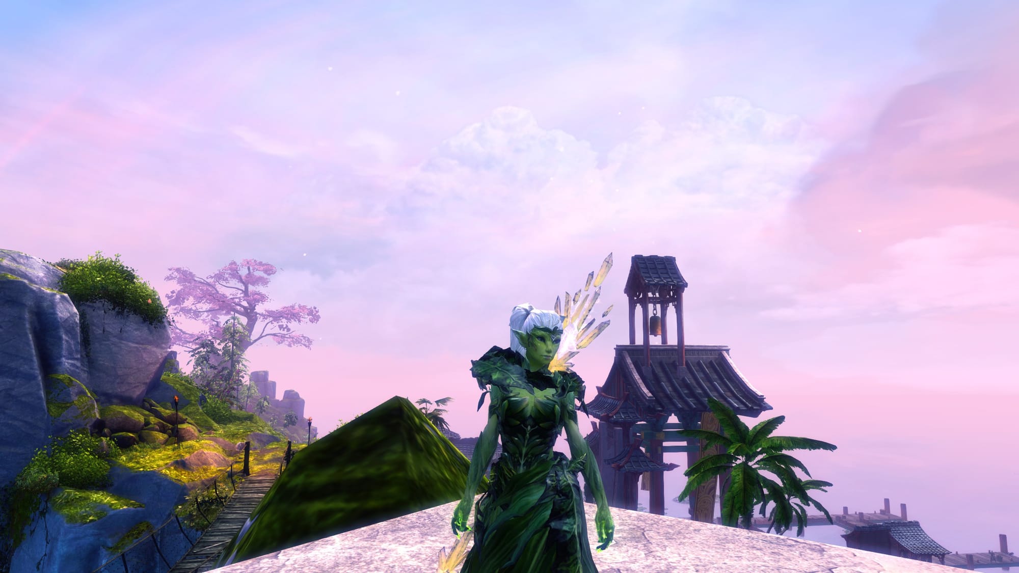 A Guild Wars 2 open-world vista — weathered ruins above still water under a hazy sky
