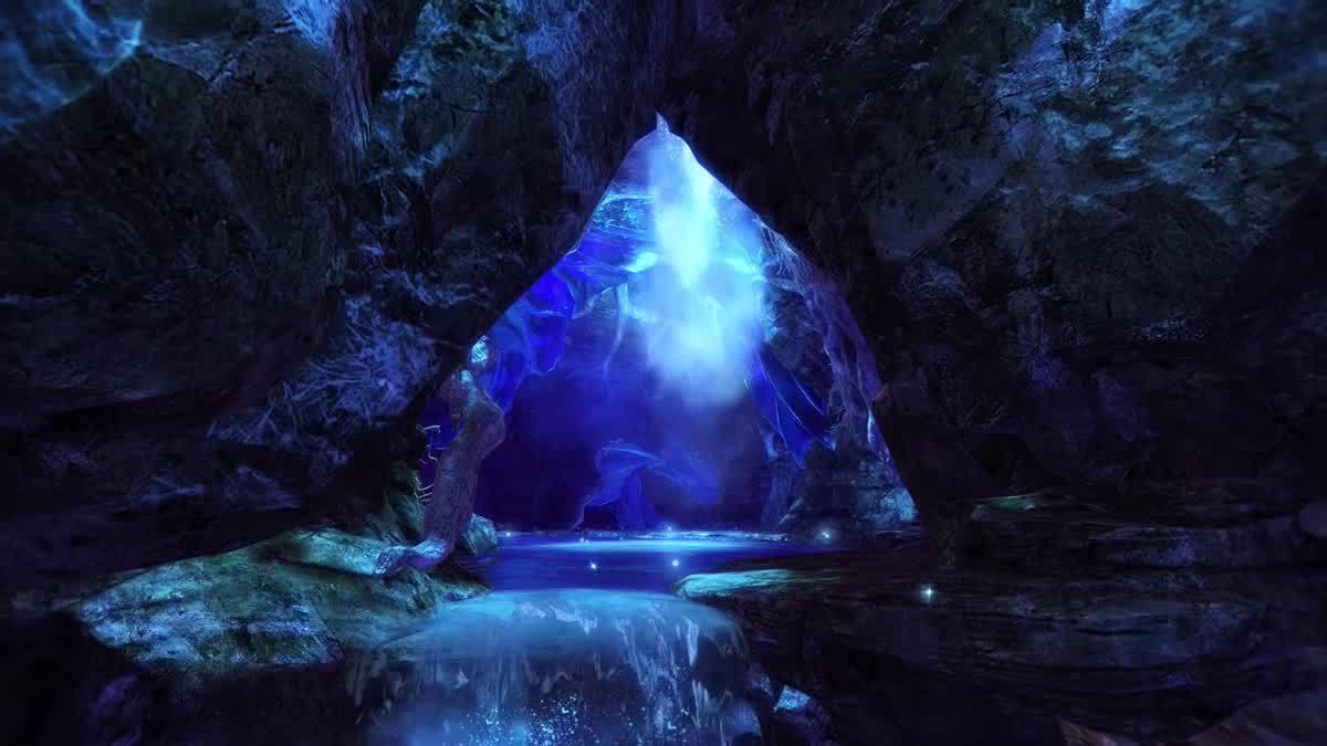 A cave opening lit by a blue waterfall above a pool of glowing water, a still from ArenaNet’s Code of Creation announce trailer