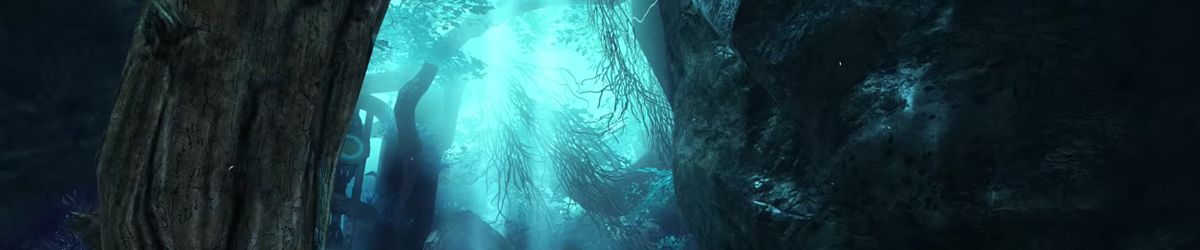 A forest cave glowing with turquoise light behind a large tree trunk, from ArenaNet’s Code of Creation announce trailer