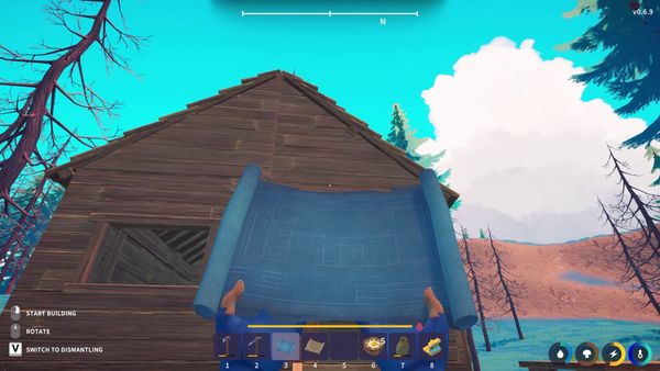 A wooden cabin seen from first person, with a building blueprint and construction controls visible.