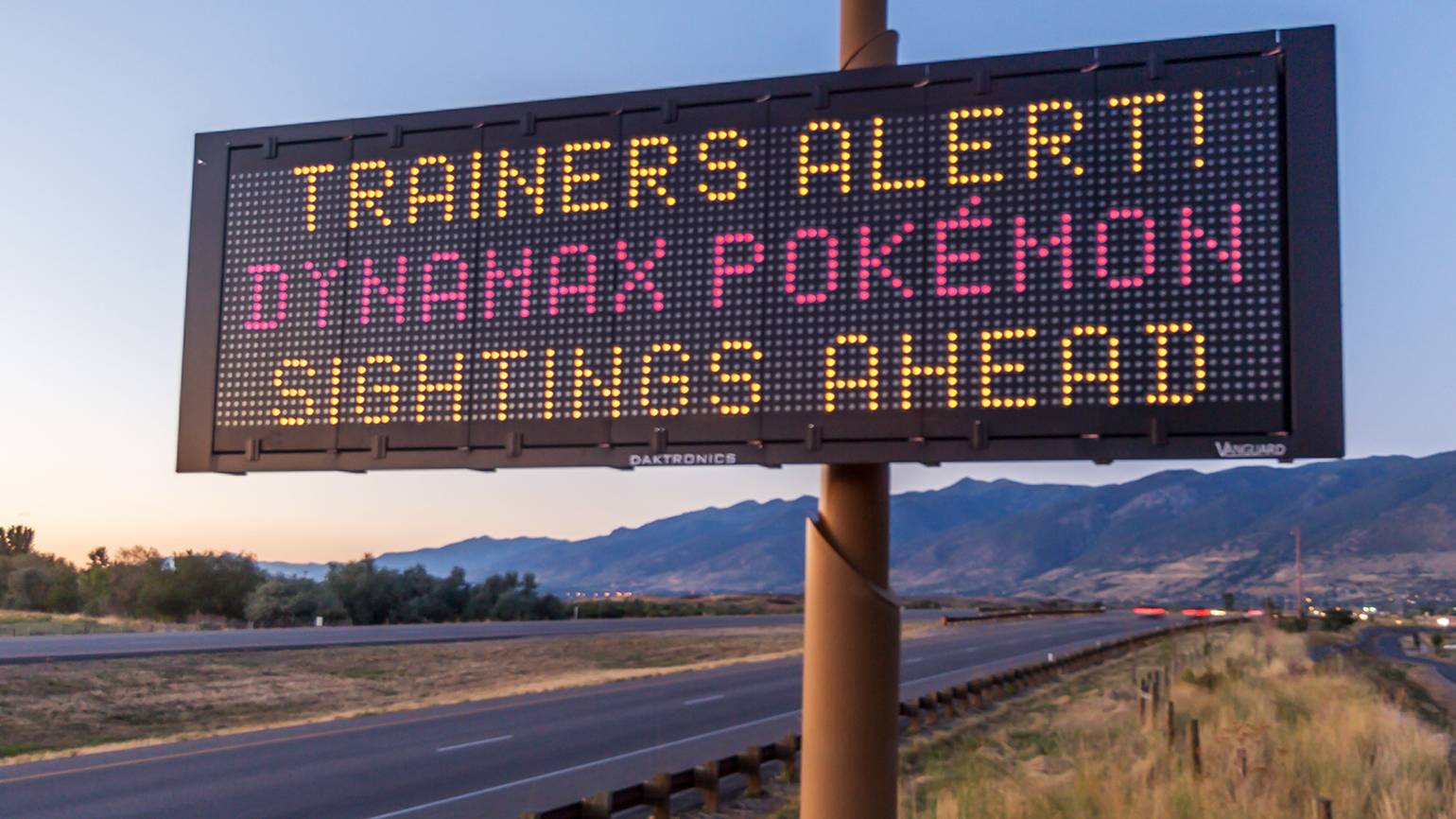 A road sign which reads "Trainers Alert! Dynamax Pokémon signings ahead".