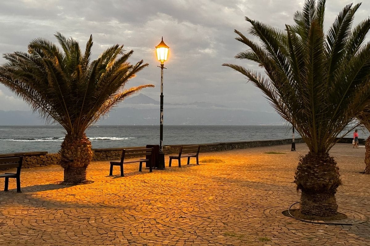 Playa De La Cueva La Gomera At San Sebastian Also Known As Cueva Beach Canary Islands Spain Promenade At Dusk With View Across Water To Mount Teide Volcano On Tenerife In The Distance