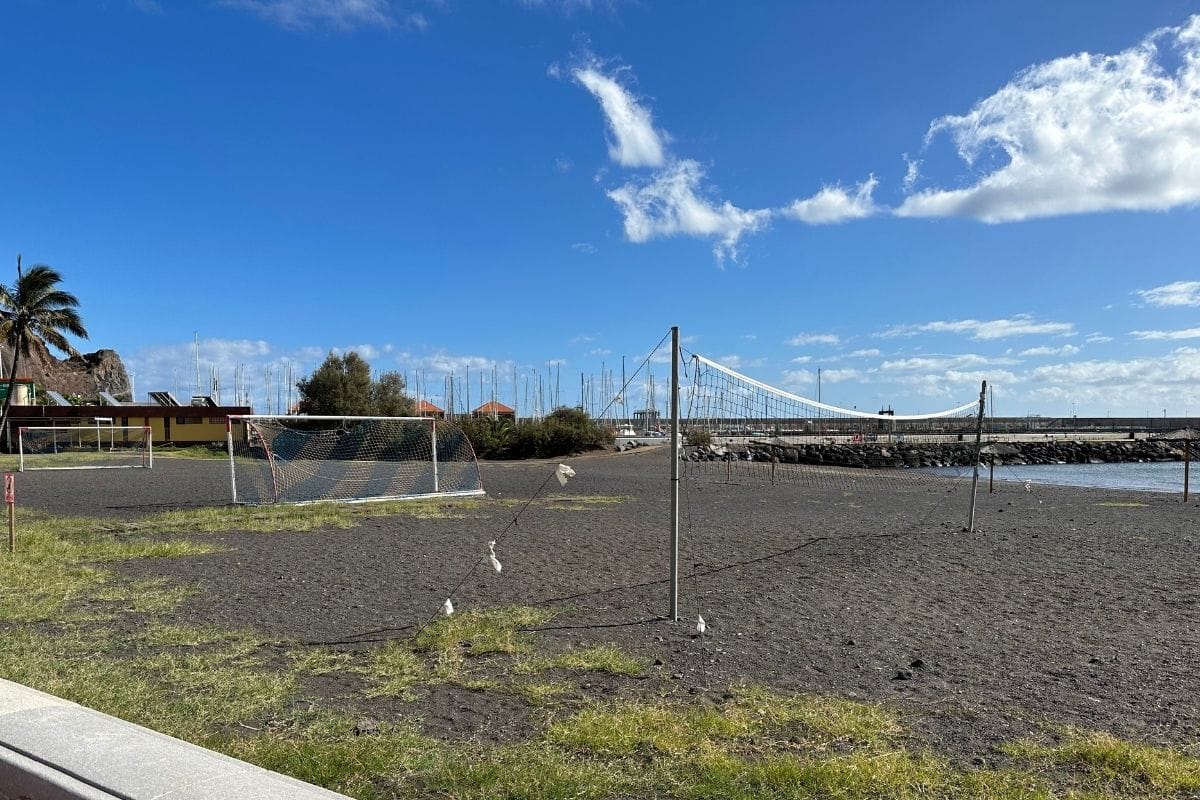 Volleyball And Football Nets At Playa De San Sebastian At La Gomera Canary Islands Spain With Harbour And Port In The Background