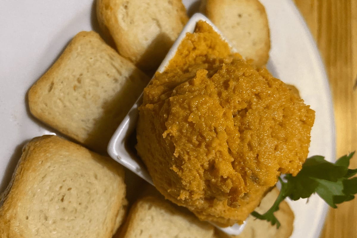 Almogrote A Traditional Food Of La Gomera shown on a plate with crackers