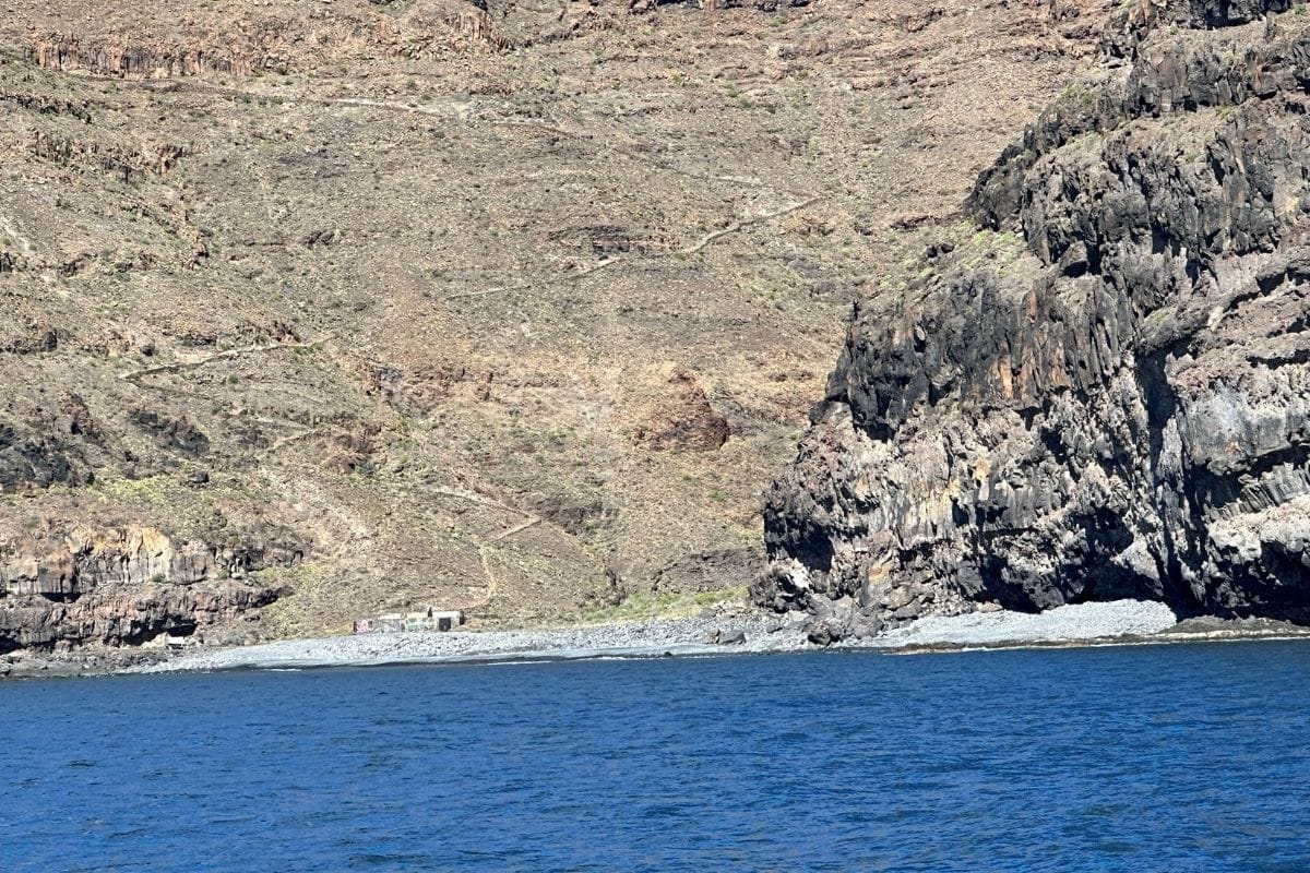 A Steep Track Runs Down The Mountain To Playa De Iguala La Gomera Canary Islands Spain With Blue Sea In The Foreground