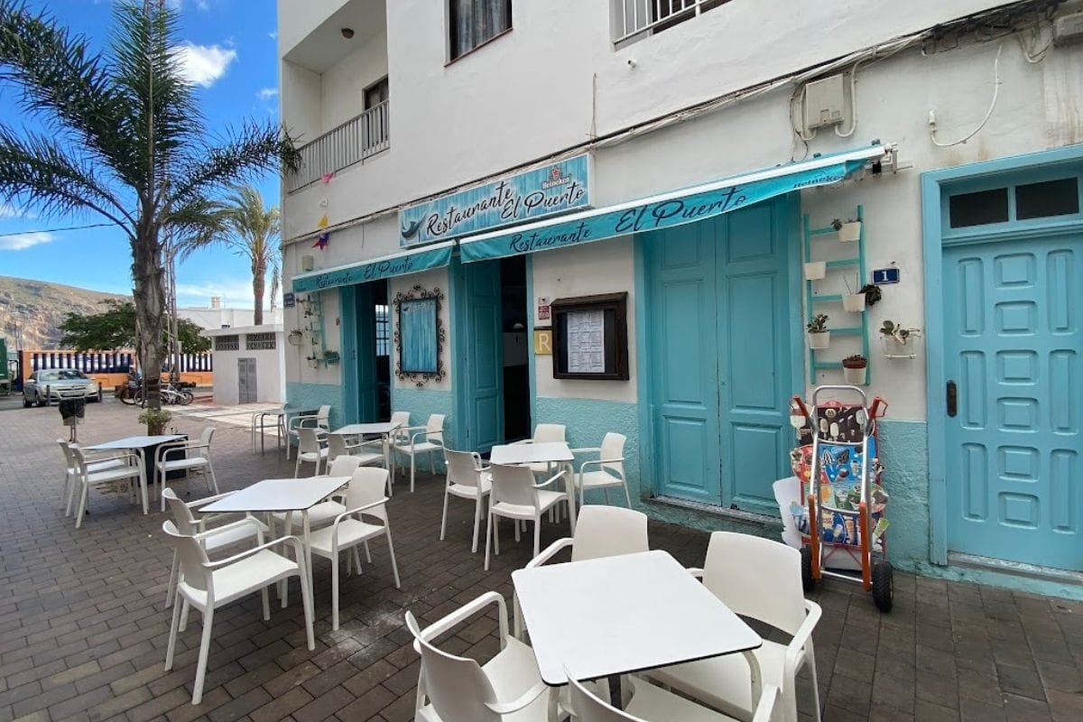 Restaurante El Puerto With Blue Doors And White Tables Close To Playa de Vueltas La Gomera At Valle Gran Rey Canary Islands Spain