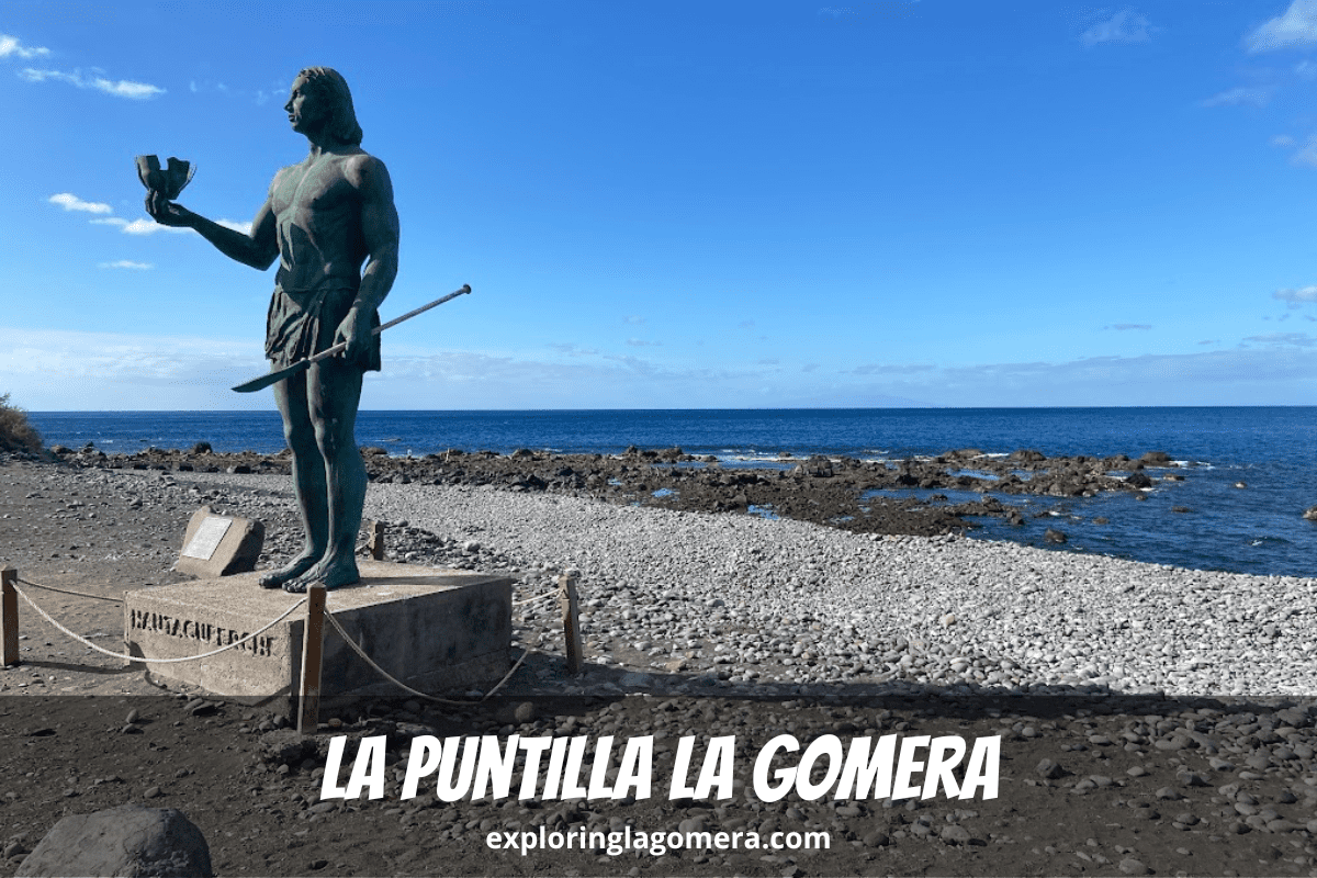 Bronze Statue Hautacuperche On A Beautiful Sunny Day Stands At The Edge Of La Puntilla La Gomera At Valle Gran Rey Town Canar