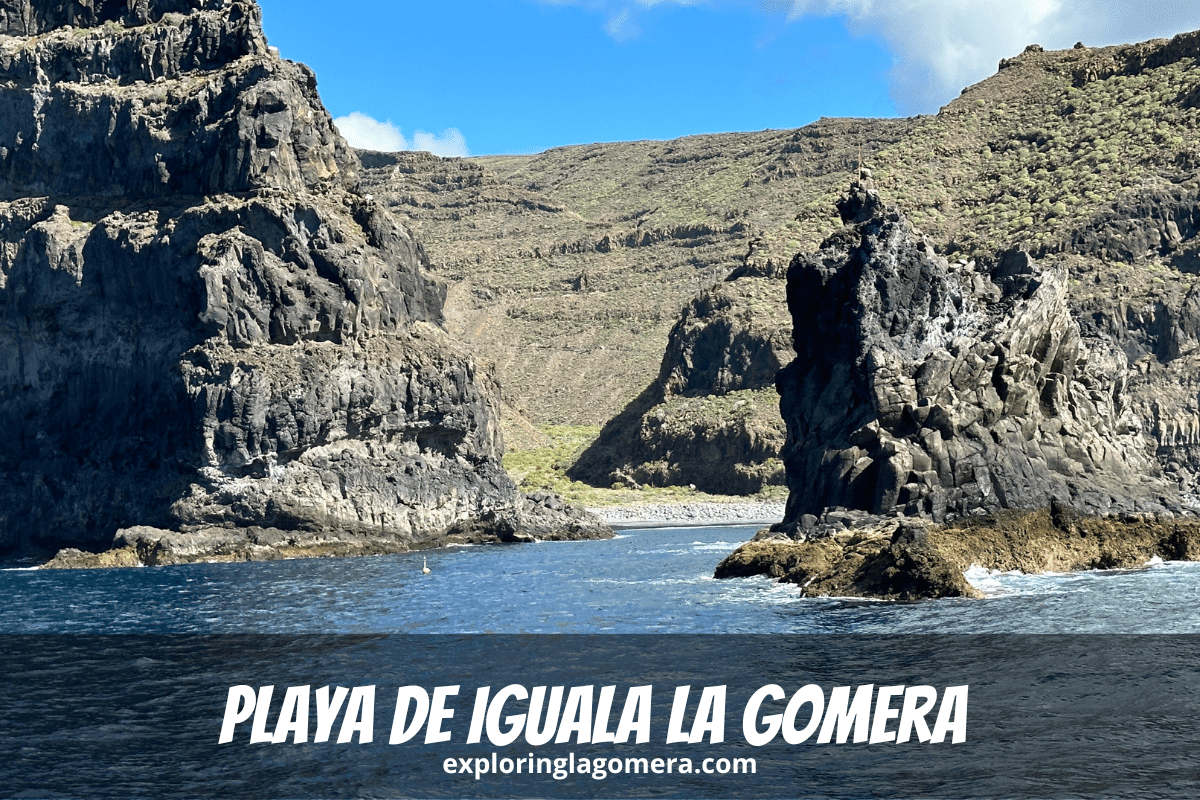 Blue Sea And Rock Formations In Front Of Playa De Iguala La Gomera Canary Islands Spain With Steep Mountains In The Backgroun