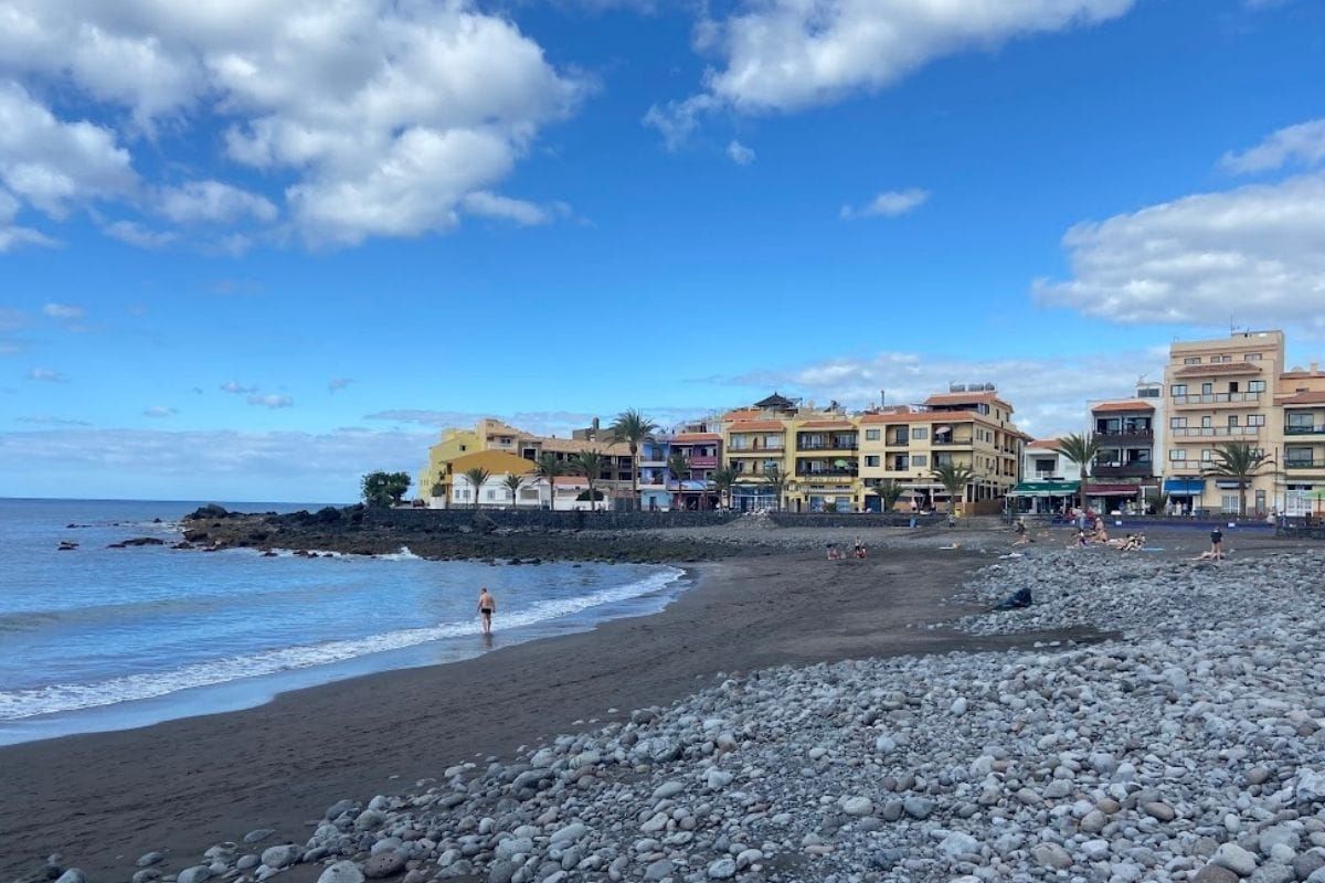 People Sit On The Beach At Playa De La Calera La Gomera At Valle Gran Rey Canary Islands Spain