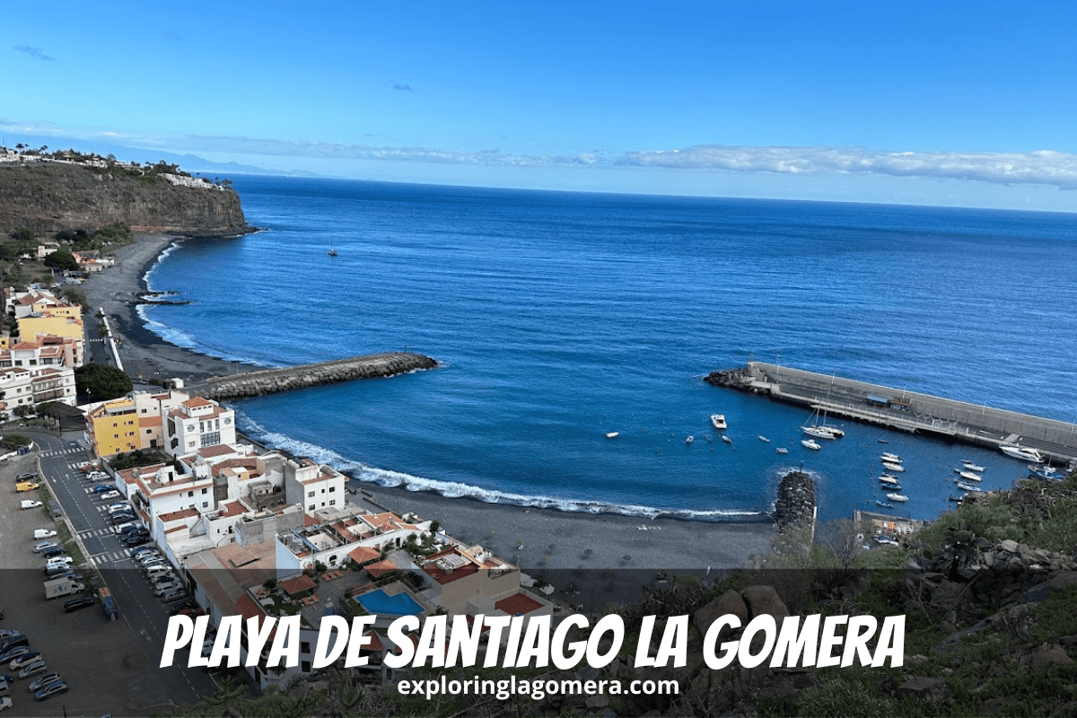 Aerial View Of Town And Beach Of Playa De Santiago La Gomera Canary Islands Spain Taken On Sunny Day With Blue Sky And Blue S
