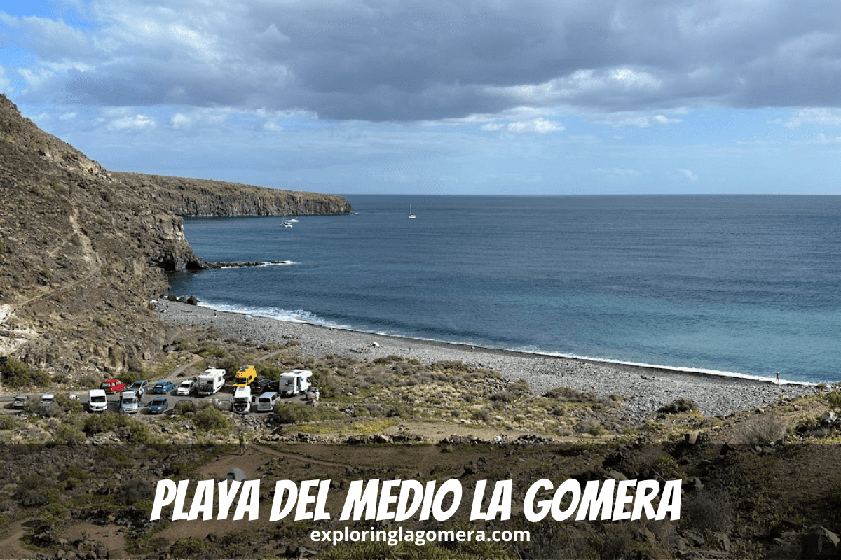 Footpath To Playa Del Medio La Gomera Canary Islands Spain Taken On Sunny Day With Blue Sky And Blue Sea Also Shows Cars In A