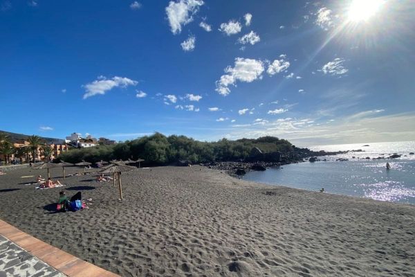 People Sit On The Beach And Swim At Charco Del Conde La Gomera At Valle Gran Rey Canary Islands Spain