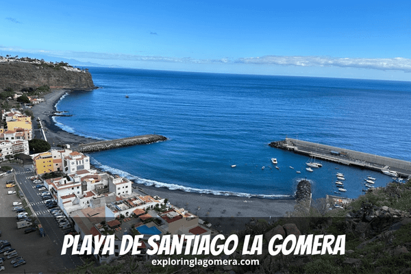 Aerial View Of Town And Beach Of Playa De Santiago La Gomera Canary Islands Spain Taken On Sunny Day With Blue Sky And Blue S