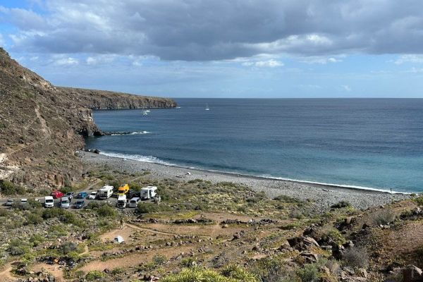 Footpath To Playa Del Medio La Gomera Canary Islands Spain Taken On Sunny Day With Blue Sky And Blue Sea Also Shows Cars