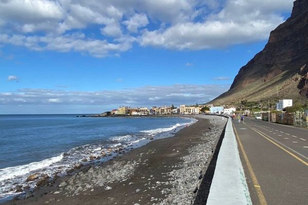 A Beautiful Sunny Day As People Walk Along The Edge Of Playa De Valle Gran Rey La Gomera At Valle Gran Rey Town Canary Island