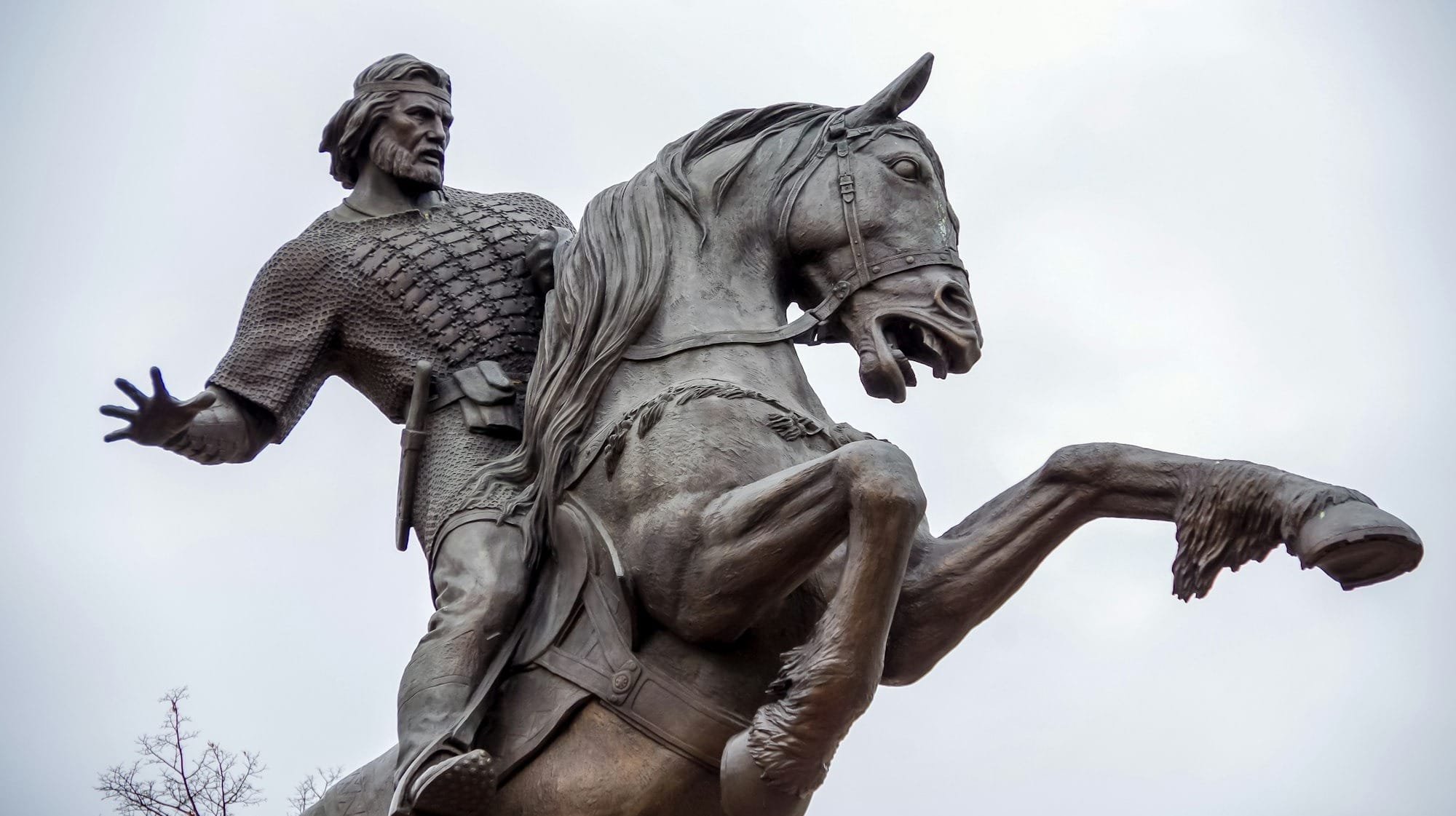 selective focus photography of man riding horse statue