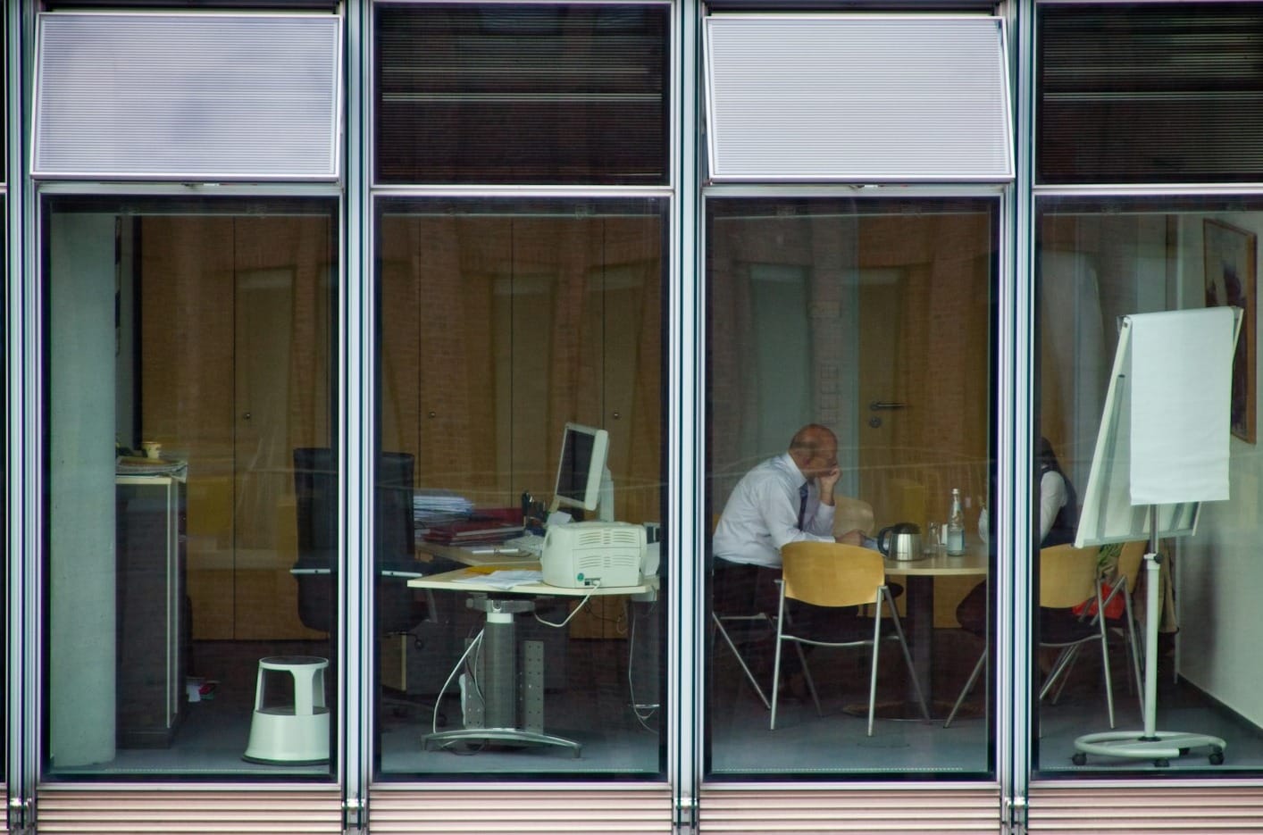 man sitting on chair inside room