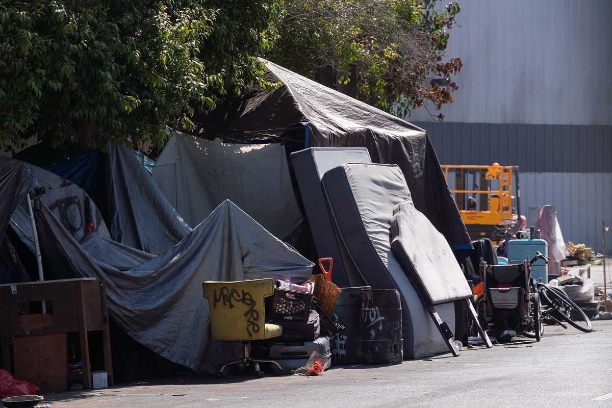 Why did a judge halt Harrison encampment closure?
