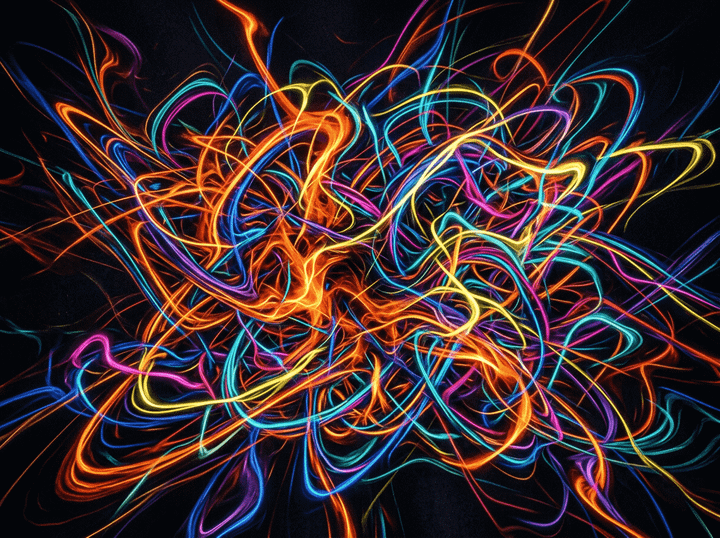 Colorful neon light trails in orange, blue, yellow, pink, and purple on black background