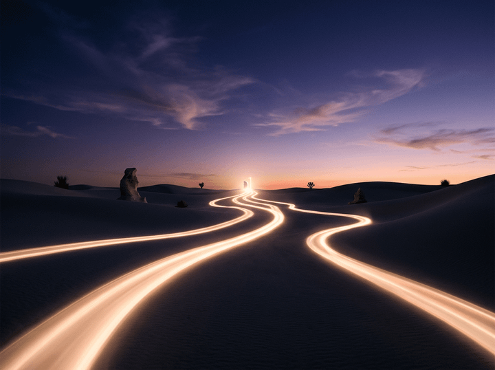 Glowing light trails winding through desert dunes at sunset