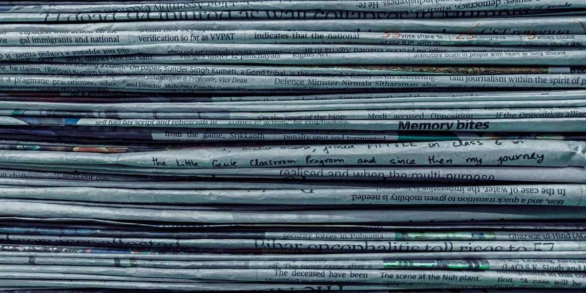 A tall stack of newspapers.