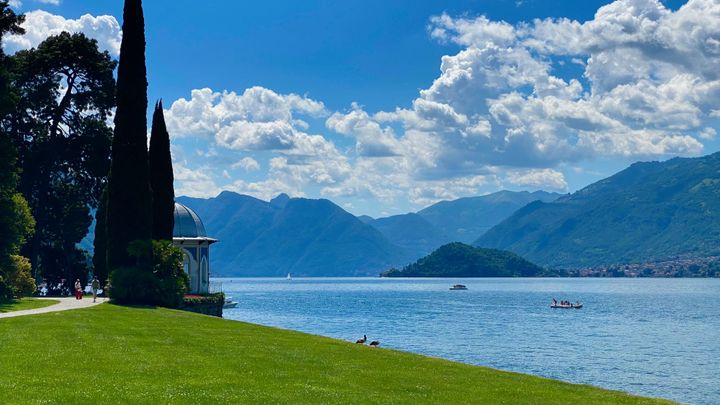 View of Lake Como blue water with the mountains in the background