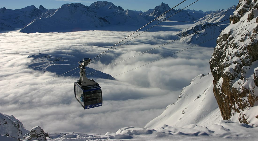 Vallugabahn cable car emerging from the clouds
