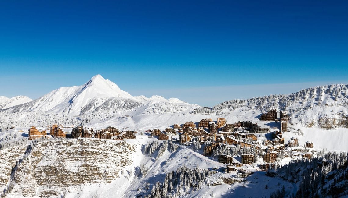 Avoriaz from afar, with buildings on top of cliff face