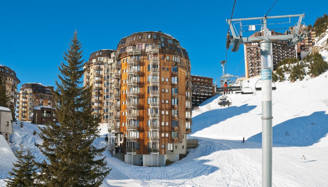 Chairlift and ski slopes right next to apartment block