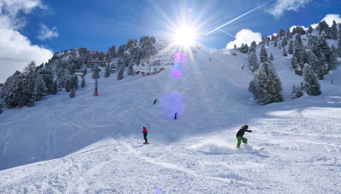 Harakiri ski slope from the bottom with skiers coming down
