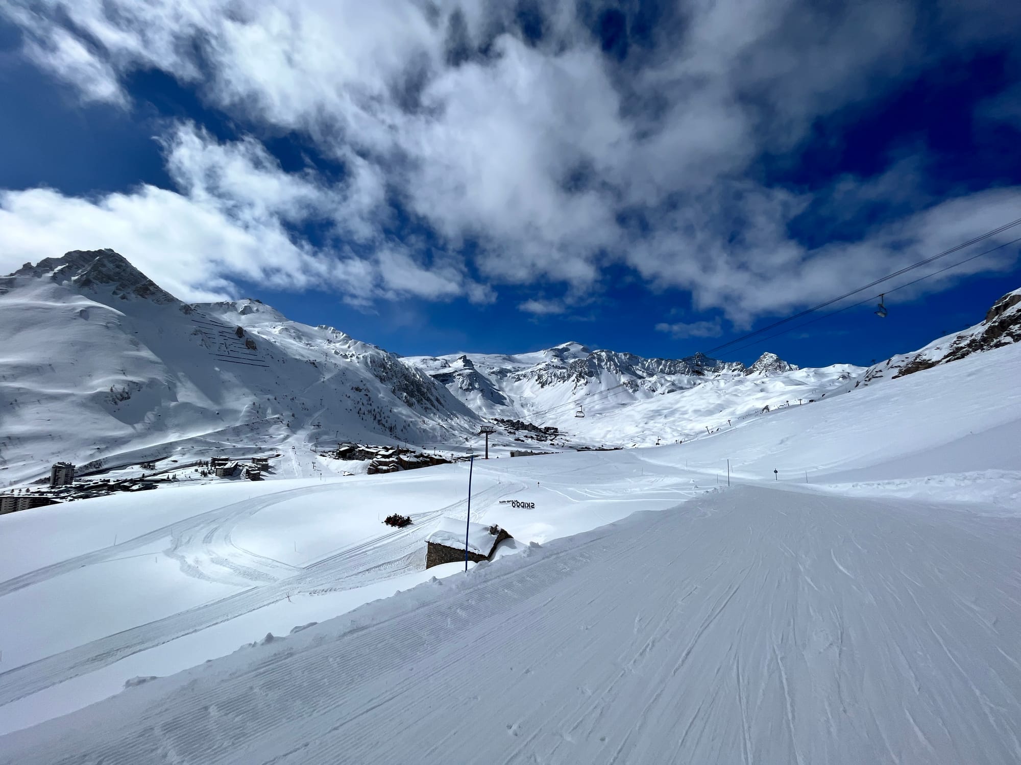 Ski slope in Tignes in Easter with blue skies and sunshine