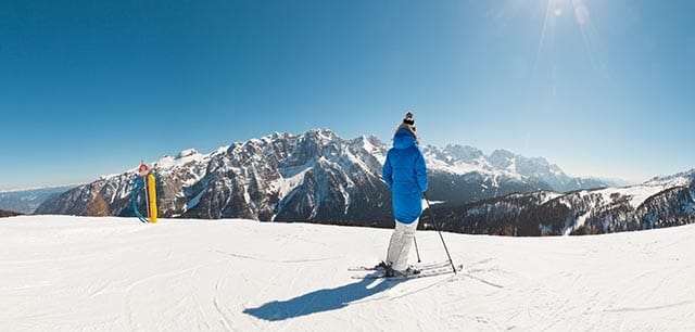 Skier looks out at panoramic view in La Plagne