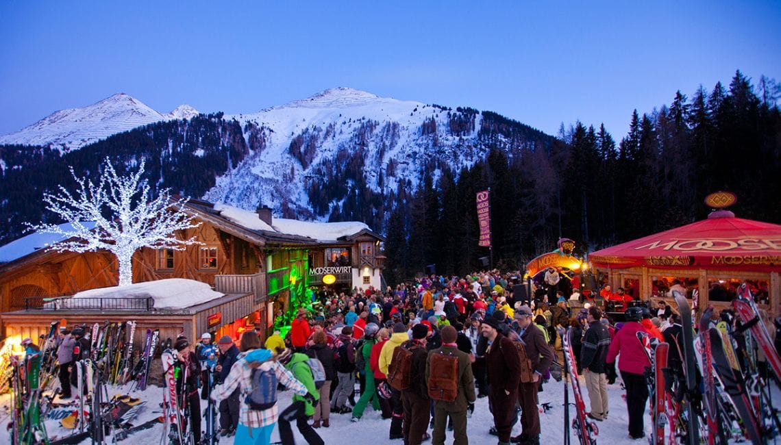 Crowds gather outside Mooserwirt apres bar in St Anton