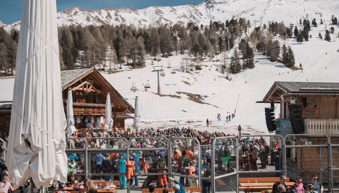 View of Paznauner Bar in Ischgl with massive crowd in the sunshine