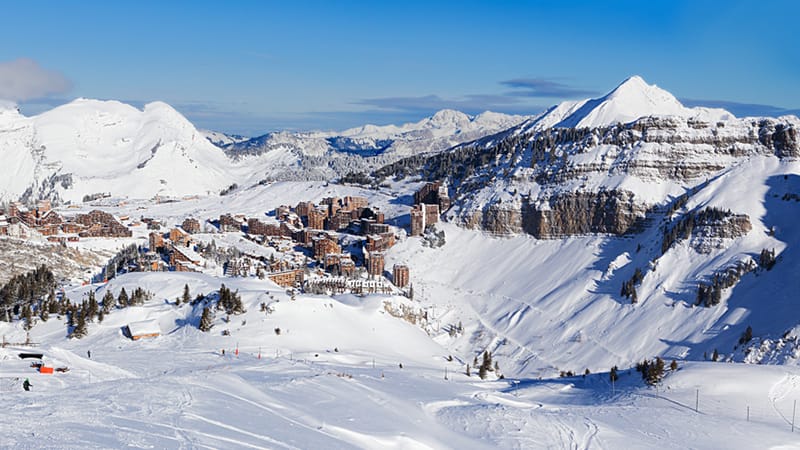 Ski area in Avoriaz with buildings on edge of cliff