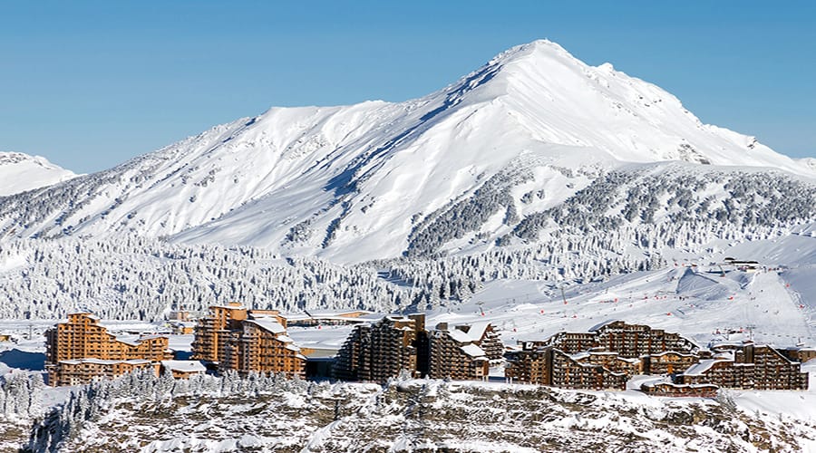Wooden Avoriaz buildings with mountain backdrop