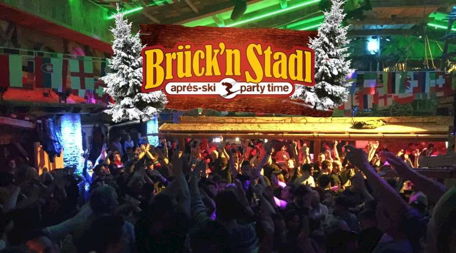 Interior of Bruck'n Stadl bar in Mayrhofen with people dancing