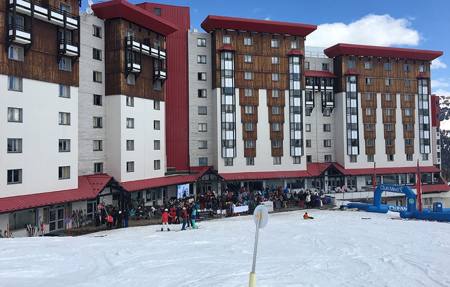 Outdoor of Club Med with ski slope attached to it