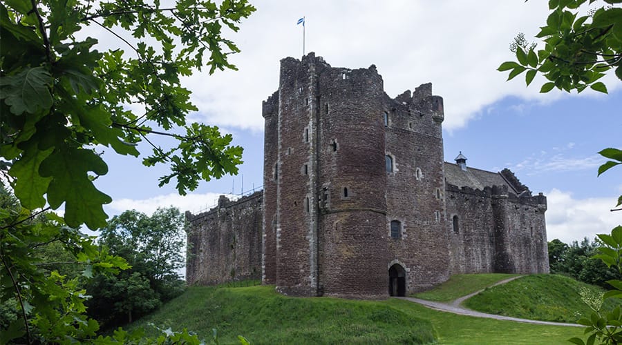 Doune Castle with leafy vegetation surrounding