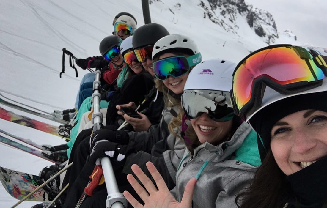 Iglu Ski team on a chairlift during a team trip