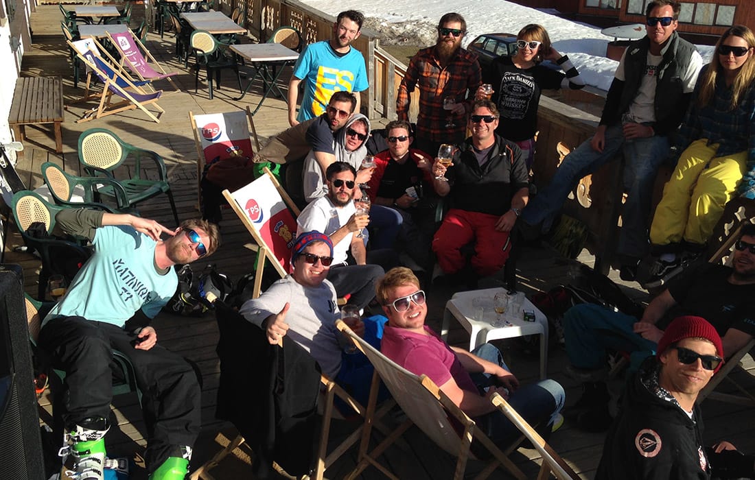 Iglu Ski team at an après-ski bar wearing sunglasses
