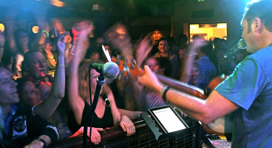 People singing and dancing to the live music in Piccadilly Bar