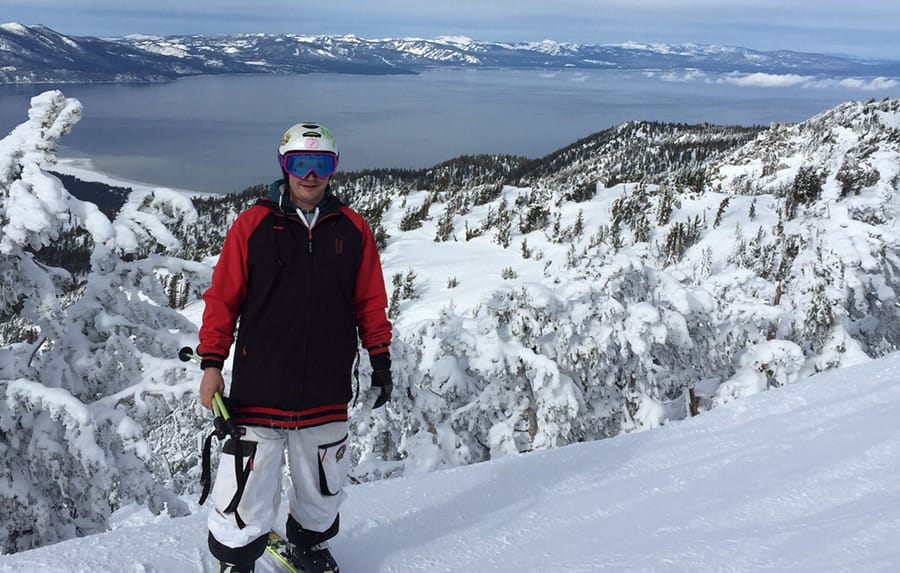 Iglu Ski team member standing on slope with trees behind in Heavenly
