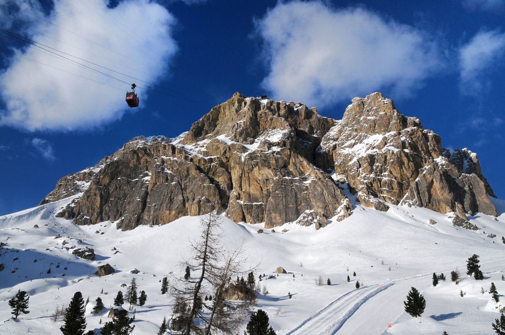 Cortina ski resort with its iconic rocky backdrop and cable car overhead
