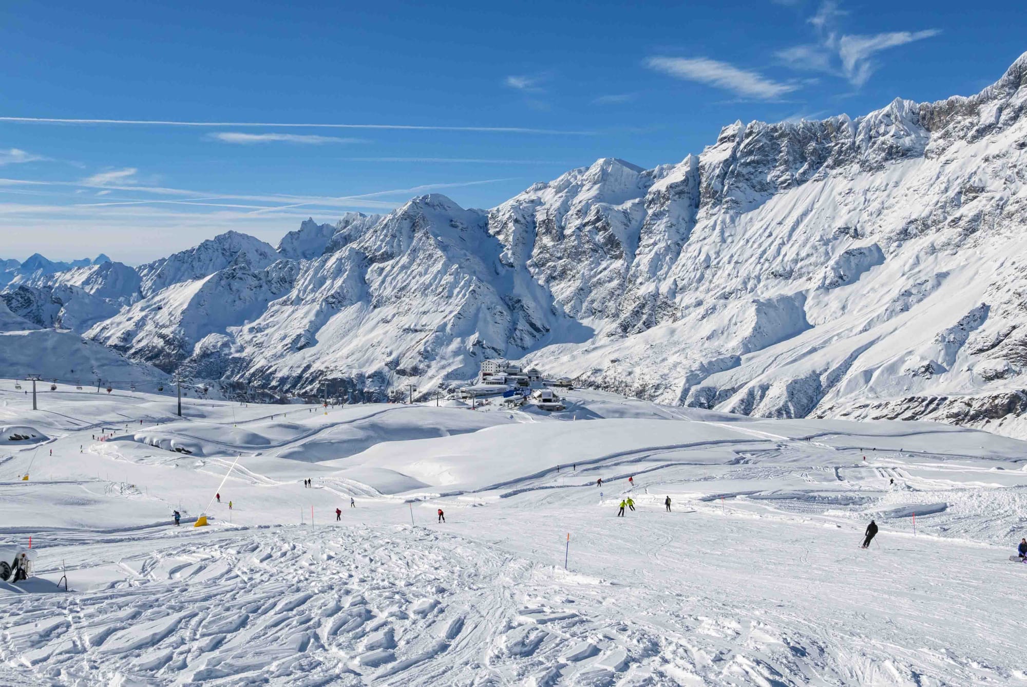 Ski slope in Cervinia with skiers and chairlift