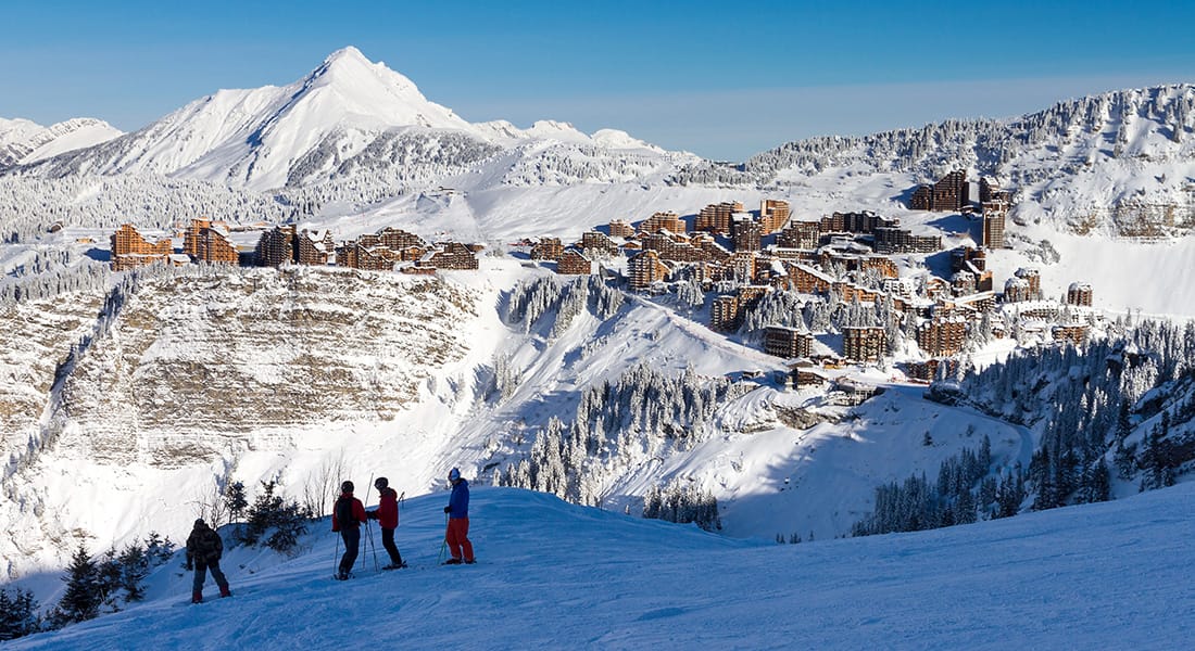 Skiers looking out towards Avoriaz in the distance